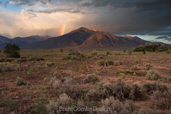 Rainbow at sunset on Taos Mountain